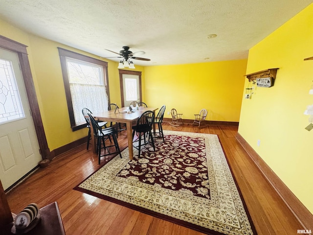 501 N Marion St, Salem, IL 62881 - dining area featuring a ceiling fan, a textured ceiling, and wood-type flooring