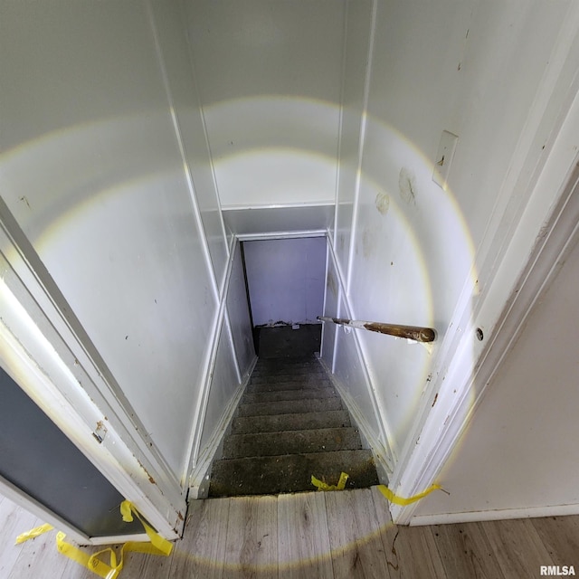 stairway with wood finished floors