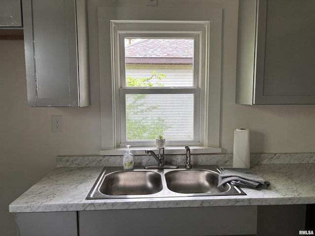 1014 E Broadway St, Centralia, IL 62801 - kitchen view of a sink, gray cabinets, and light countertops