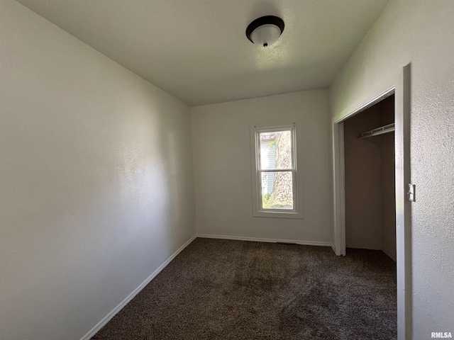 1014 E Broadway St, Centralia, IL 62801 - unfurnished bedroom featuring carpet, baseboards, and a closet