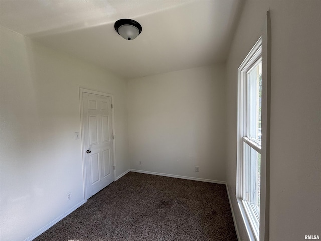 1014 E Broadway St, Centralia, IL 62801 - spare room with dark colored carpet and baseboards