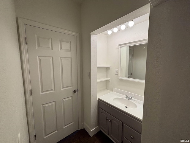 1014 E Broadway St, Centralia, IL 62801 - bathroom featuring vanity and wood finished floors