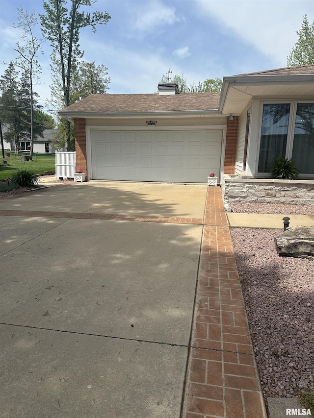 exterior space featuring concrete driveway