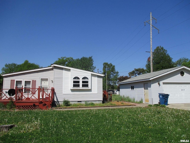 manufactured / mobile home with a deck, a garage, a front yard, and crawl space
