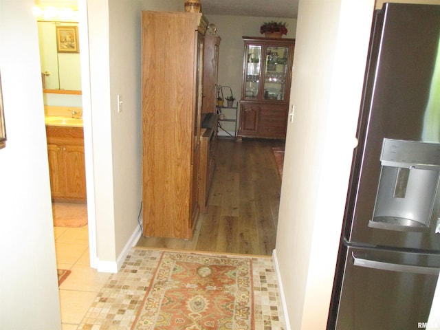1607 Marion St, Carterville, IL 62918 - corridor featuring a sink, baseboards, and tile patterned floors