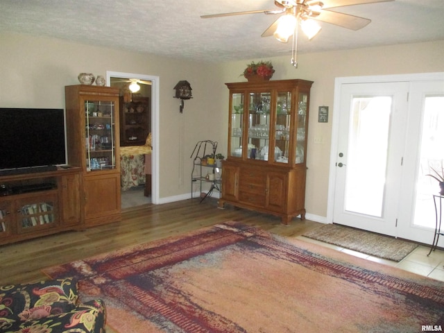 1607 Marion St, Carterville, IL 62918 - foyer entrance with ceiling fan, wood finished floors, and baseboards