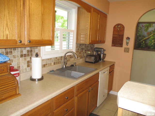 1607 Marion St, Carterville, IL 62918 - kitchen with a sink, white dishwasher, backsplash, and light countertops