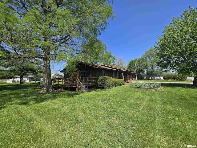 view of yard featuring a wooden deck