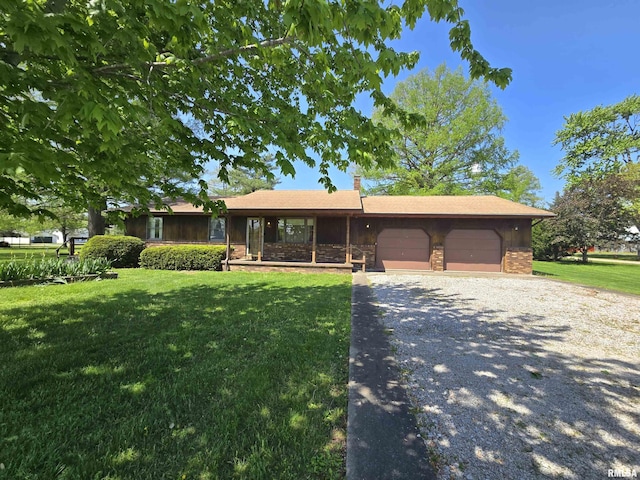 ranch-style house with a garage, a front lawn, driveway, and a chimney