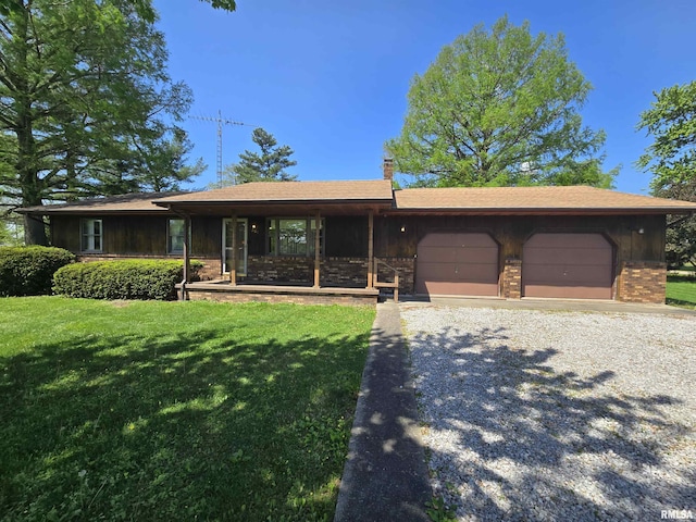 ranch-style home featuring a garage, a front lawn, driveway, and a chimney