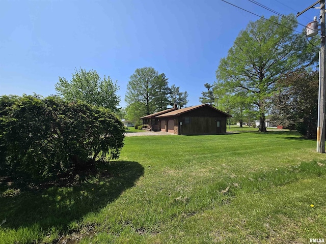 view of yard with a garage