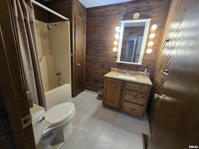 bathroom with visible vents, vanity, toilet, wooden walls, and shower / bath combo