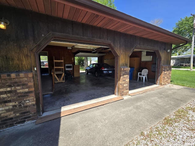 view of vehicle parking with a garage