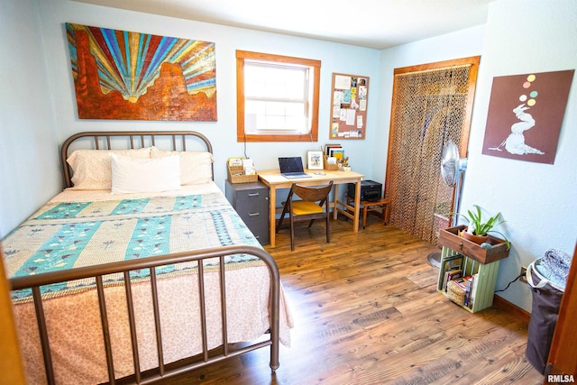 bedroom featuring wood finished floors