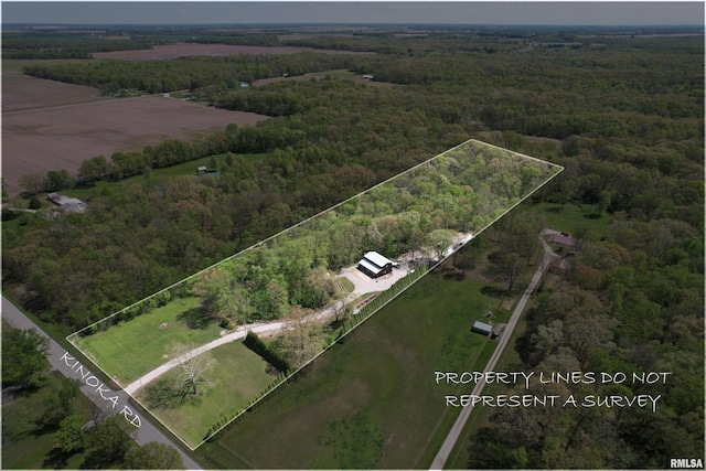 bird's eye view featuring a wooded view