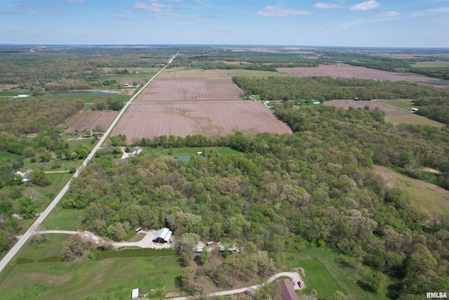 birds eye view of property with a rural view and a forest view