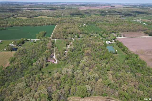 birds eye view of property featuring a rural view and a view of trees
