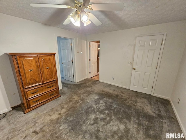 unfurnished bedroom with baseboards, a textured ceiling, and carpet