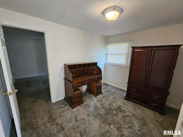 interior space with dark carpet and baseboards
