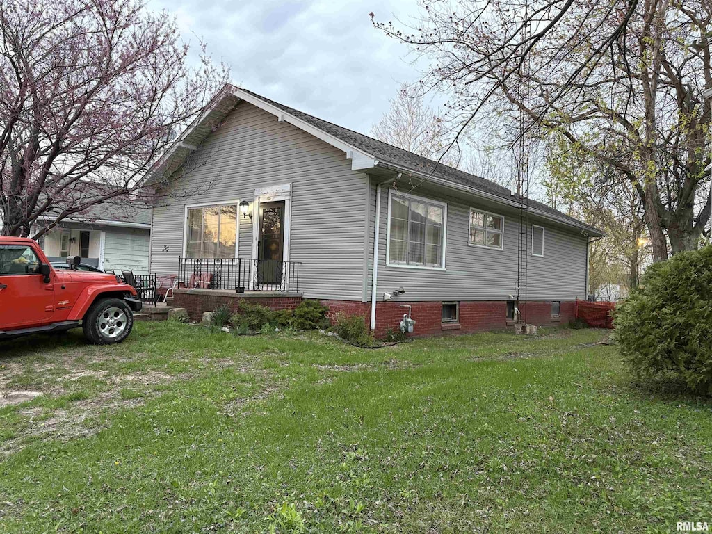 210 N Gardner St, West Frankfort, IL 62896 - view of home's exterior with a yard