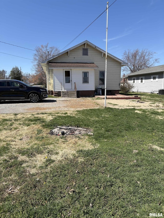 920 S 12th St, Herrin, IL 62948 - back of house with a yard, entry steps, and central air condition unit