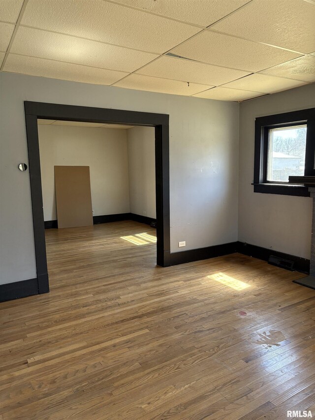 920 S 12th St, Herrin, IL 62948 - unfurnished room featuring baseboards, a drop ceiling, and wood finished floors