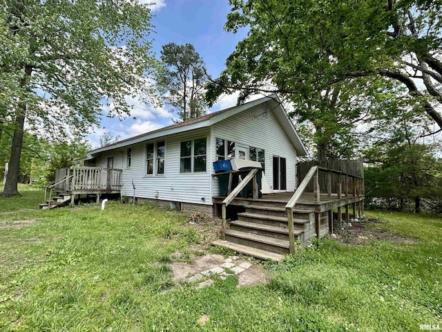 back of property with a deck