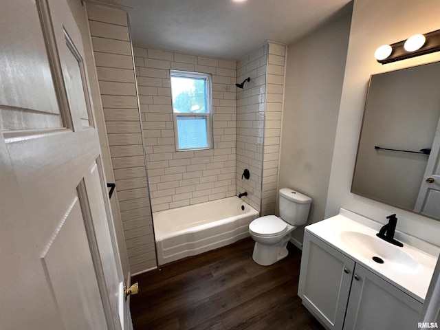 800 Division St, Carterville, IL 62918 - full bathroom featuring vanity, toilet, wood finished floors, and shower / tub combination