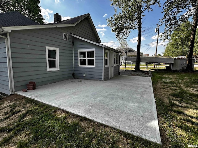 800 Division St, Carterville, IL 62918 - rear view of house featuring a patio and a yard