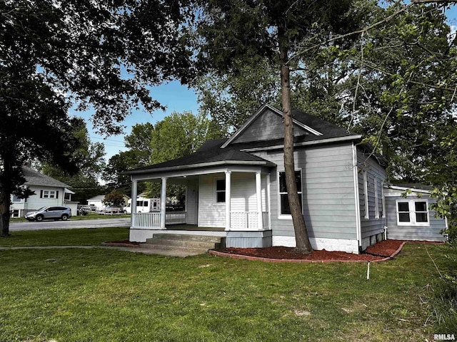 800 Division St, Carterville, IL 62918 - view of front facade with a porch and a front yard