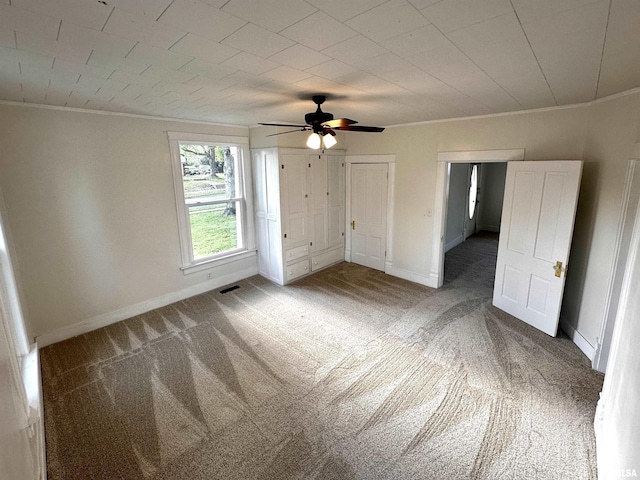 800 Division St, Carterville, IL 62918 - unfurnished bedroom featuring visible vents, ornamental molding, and carpet