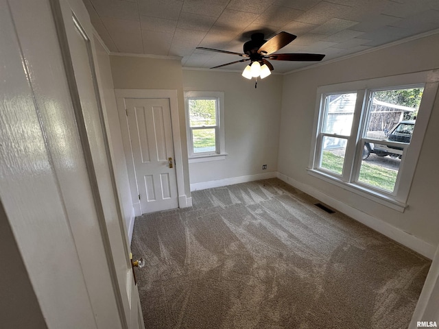 800 Division St, Carterville, IL 62918 - unfurnished bedroom featuring baseboards, ornamental molding, carpet, and ceiling fan