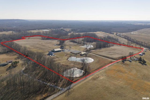 birds eye view of property featuring a rural view