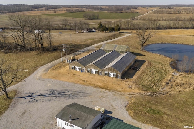drone / aerial view with a water view and a rural view