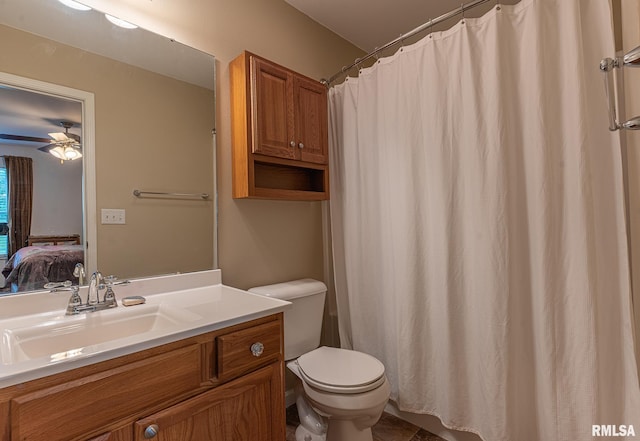 bathroom with vanity, a ceiling fan, toilet, and ensuite bath