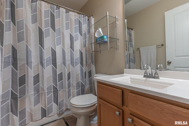 full bath featuring toilet, curtained shower, and vanity