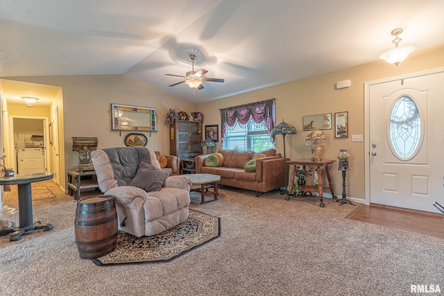 carpeted living area with washer / clothes dryer, ceiling fan, and vaulted ceiling