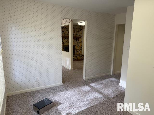 301 S Pershing St, Energy, IL 62933 - empty room featuring baseboards and carpet
