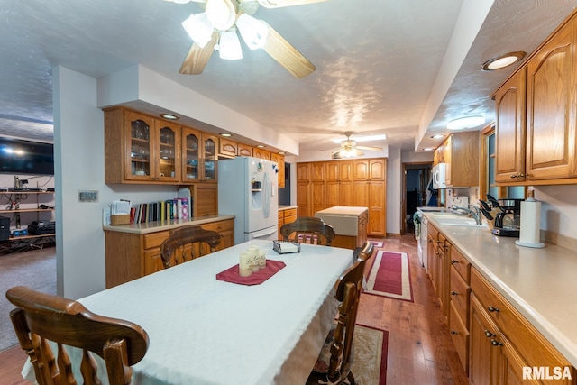 dining space featuring recessed lighting, a ceiling fan, and hardwood / wood-style flooring