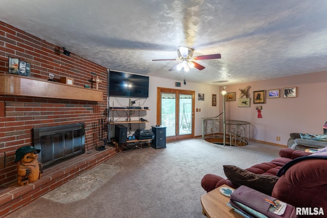 carpeted living room featuring a textured ceiling, baseboards, a ceiling fan, and a brick fireplace