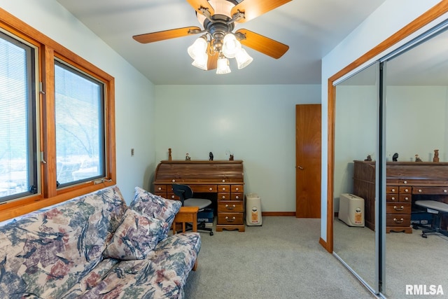 bedroom with a closet, a ceiling fan, and carpet