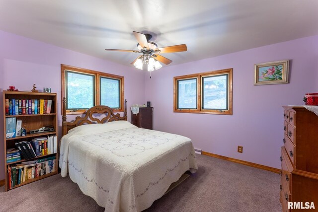 bedroom with carpet flooring, a ceiling fan, and baseboards