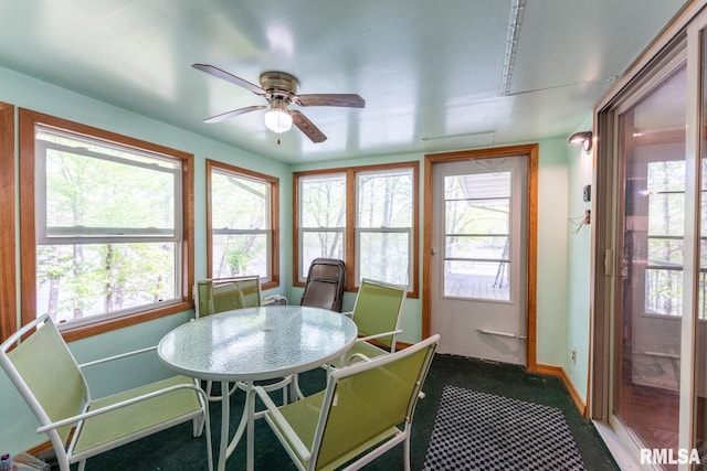 sunroom / solarium with carpet floors and baseboards