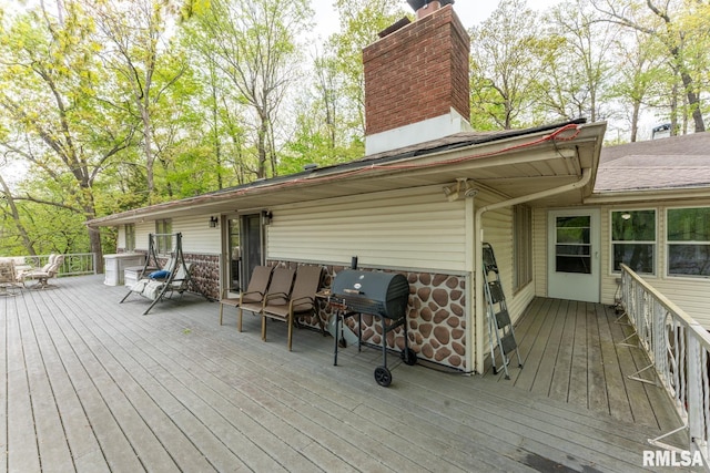 wooden deck featuring grilling area