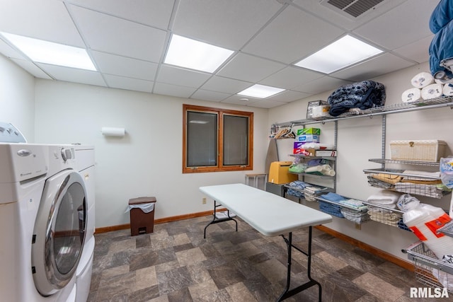 laundry room featuring baseboards, laundry area, washer / dryer, and visible vents
