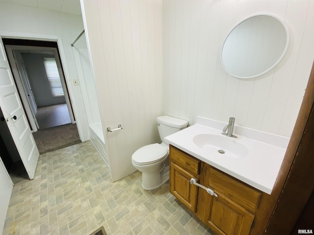 full bath featuring shower / washtub combination, vanity, brick patterned floor, toilet, and wooden walls