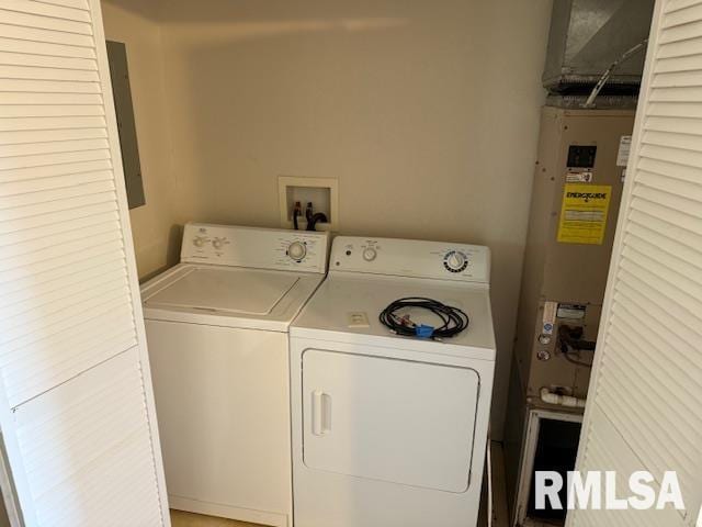 laundry area featuring laundry area, electric panel, and washer and dryer