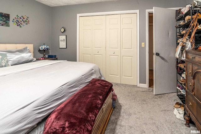 bedroom with a closet and carpet flooring