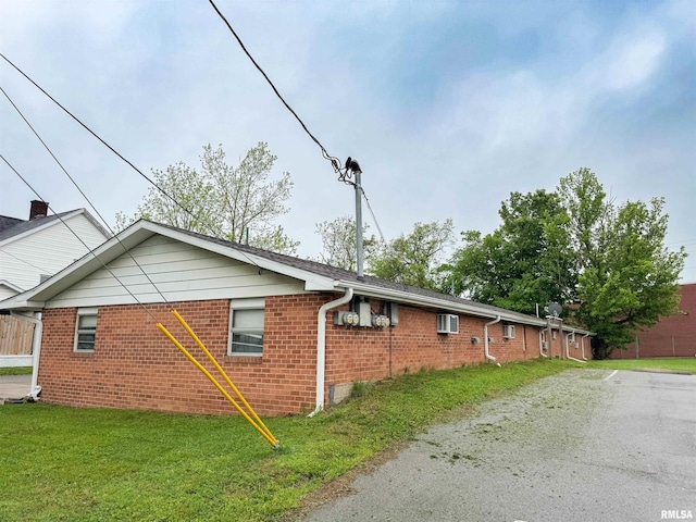 101 E Spring St, Anna, IL 62906 - view of home's exterior with a yard and brick siding