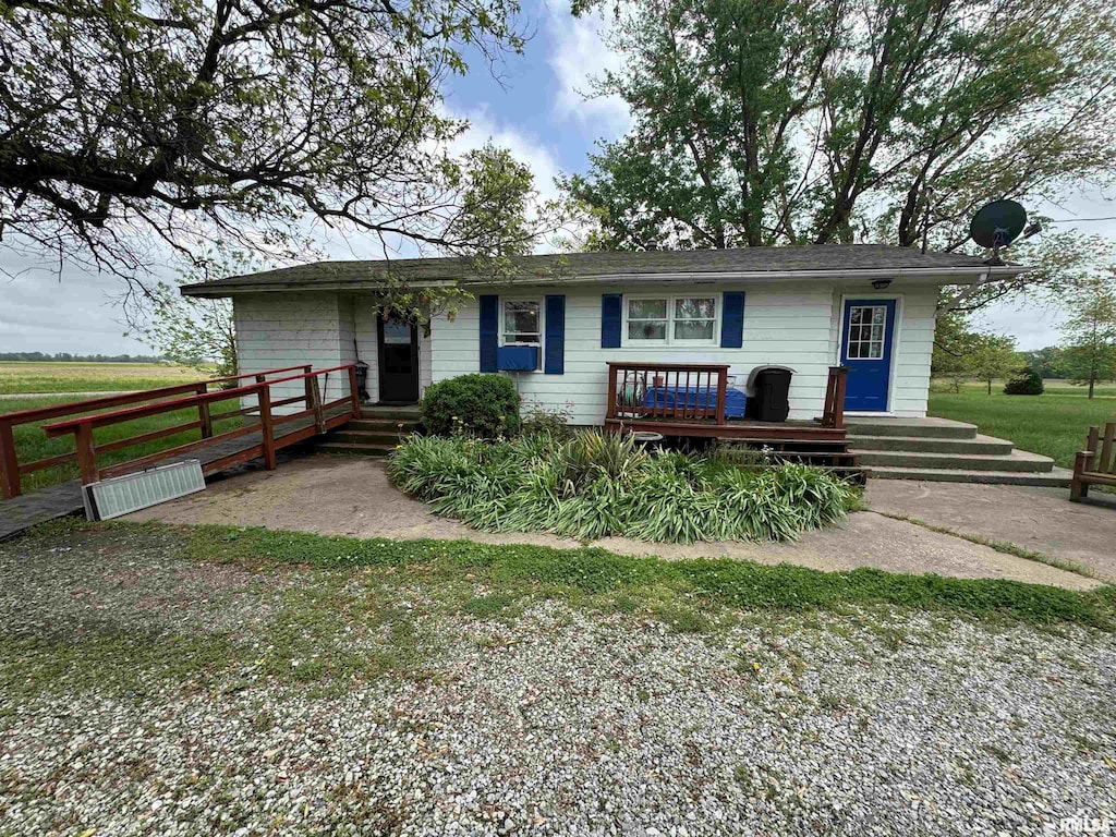 ranch-style home featuring a deck